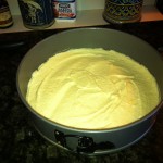 The white cake ready to go in